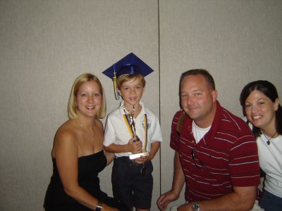 Sheri, Jack, BrotherJohn and his wife Aimee -Jack's Kindergarten Grad. in May