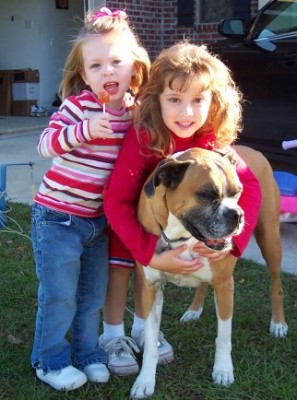 Amber is going to be a cheerleader. Here she is the other afternoon at my brother's house with her cousin Carson and dog Beaux.