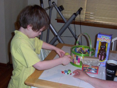 Connor's too busy to realize that mom is pilfering some of his candy